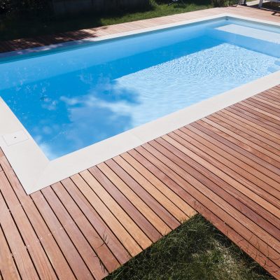 Drone flight over pool with beautiful wooden terrace
